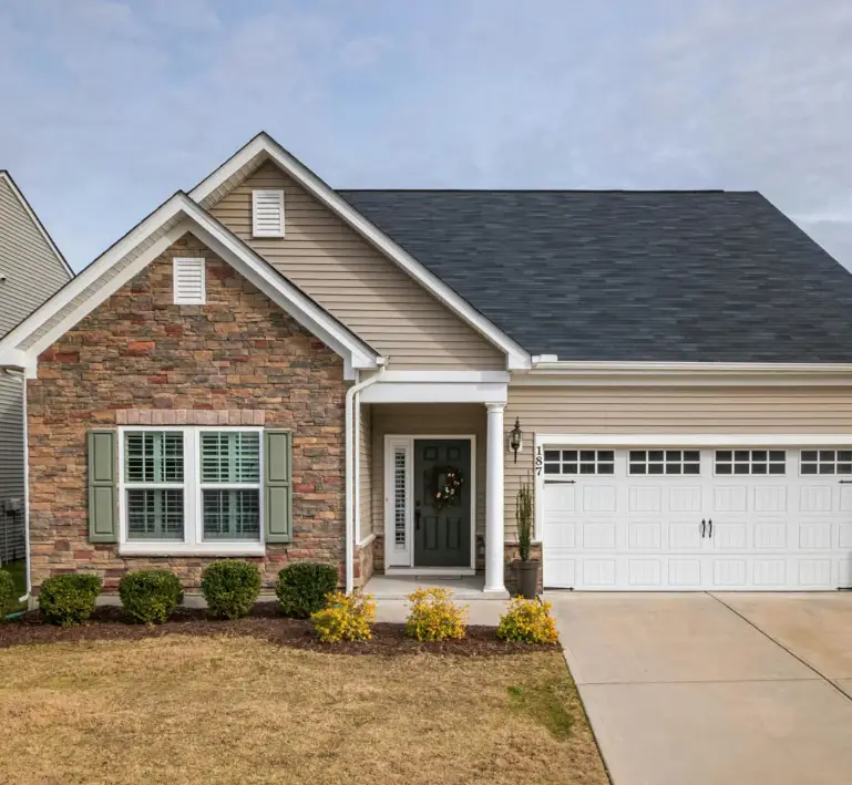 A one-story home with two gables and a two-car garage.