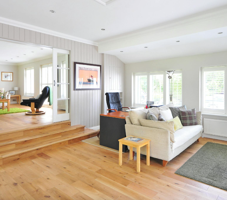 A sunken living room with three steps.